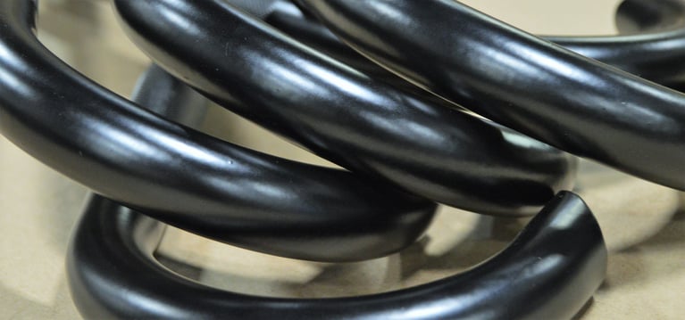 Dark steel tubes bent into a curved shape