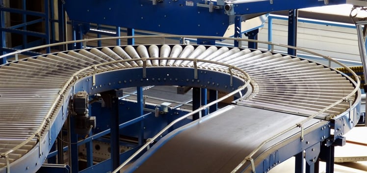 A conveyor belt in the steel tube bending process