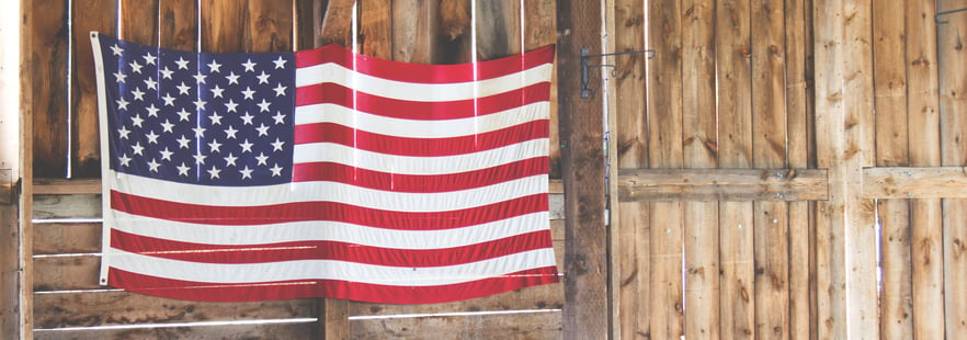 American flag draped across a wooden wall