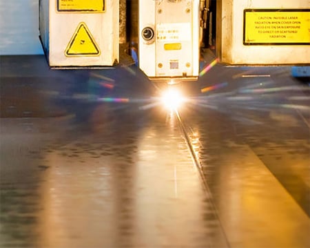 laser cutting a sheet of metal