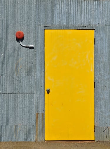 Industrial yellow exterior steel door