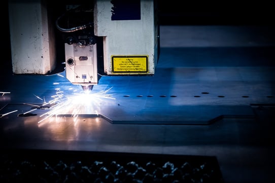 Laser cutter producing sparks on sheet metal