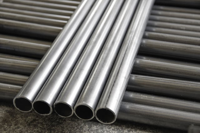 Round aluminum tubes laying across each other